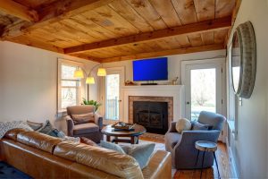 The wood ceiling adds to the lodge style of this space